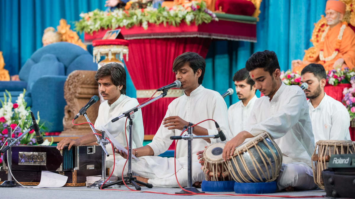 Youths sing kirtans