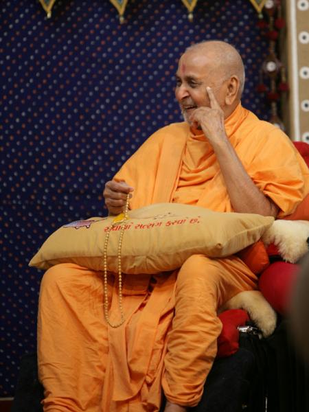 Swamishri in a divine, jovial mood during the drama presentation