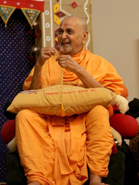 Swamishri in a divine, jovial mood during the drama presentation
