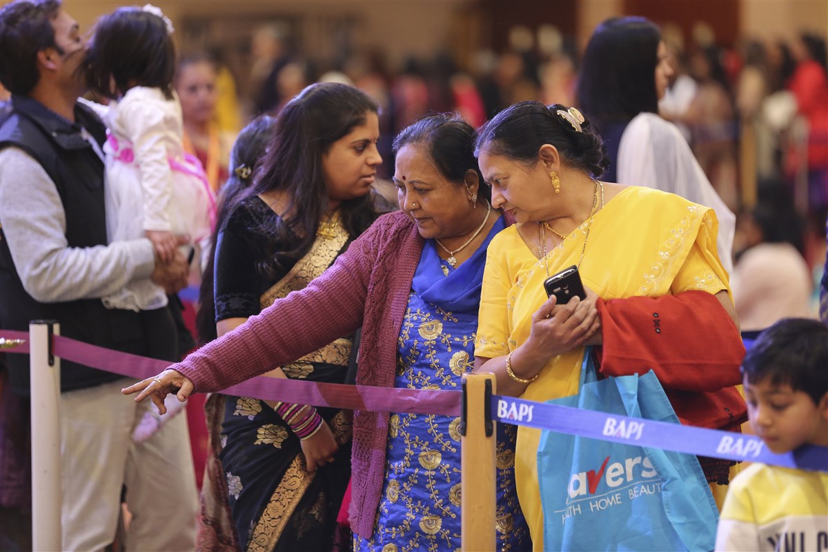 Visitors enjoy darshan of the artistic rangoli designs