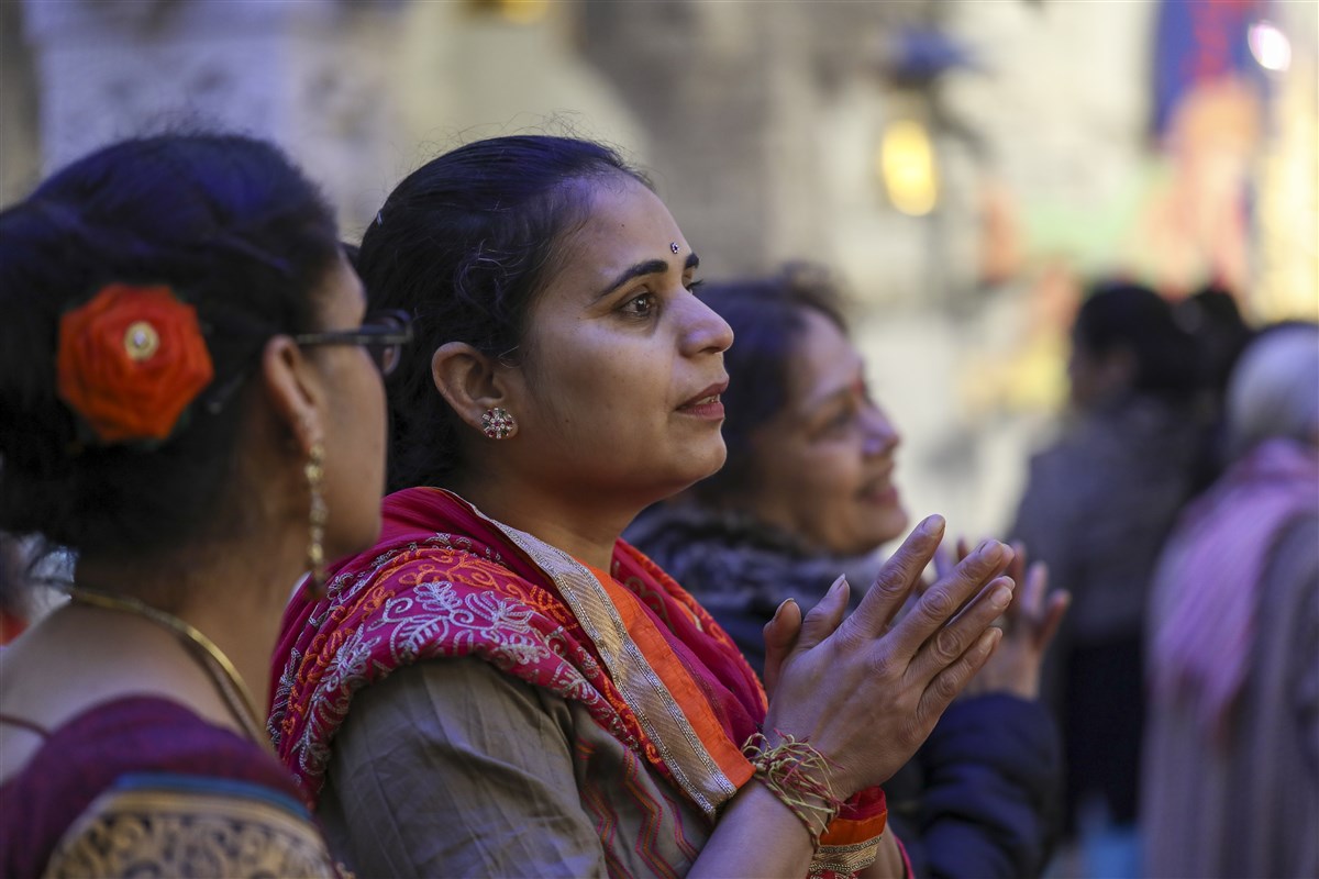 A visitor engrossed in darshan
