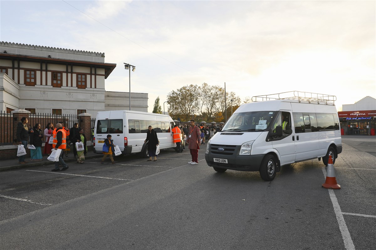 From the car parks, visitors were shuttled to and from the Mandir in minibuses throughout the day