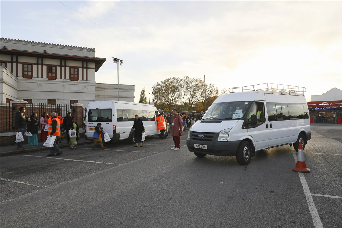 From the car parks, visitors were shuttled to and from the Mandir in minibuses throughout the day