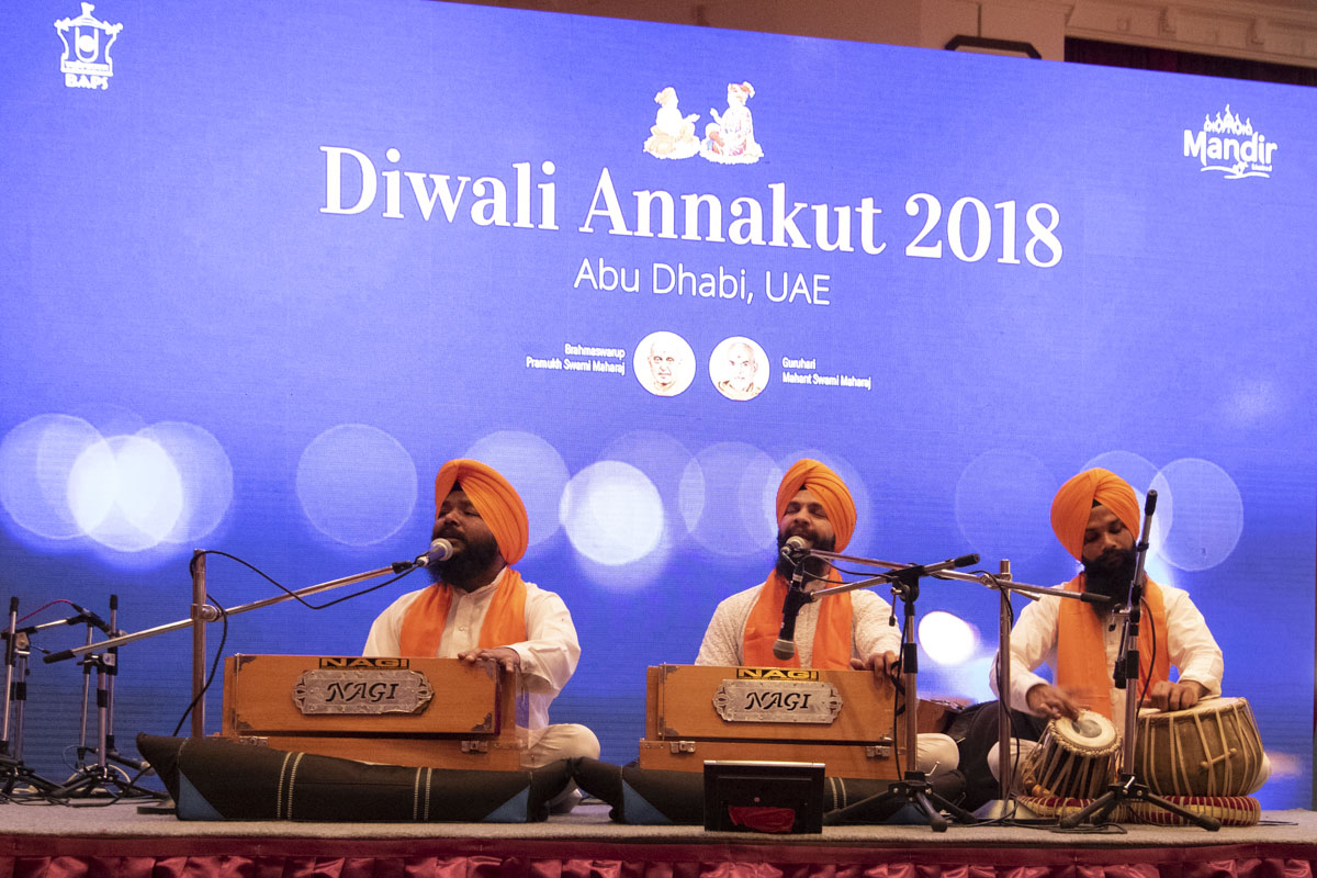 Devotees of the Sikh community sing devotional songs