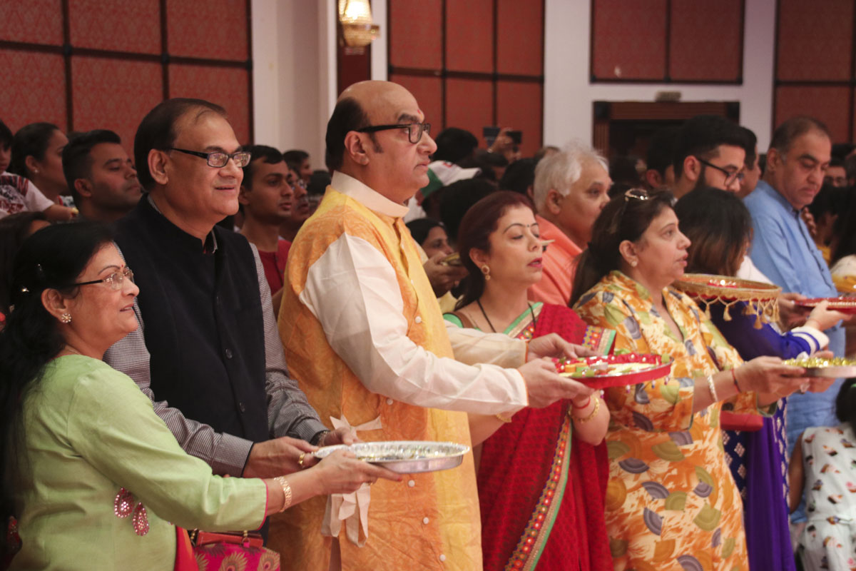 Invited guests participate in the arti