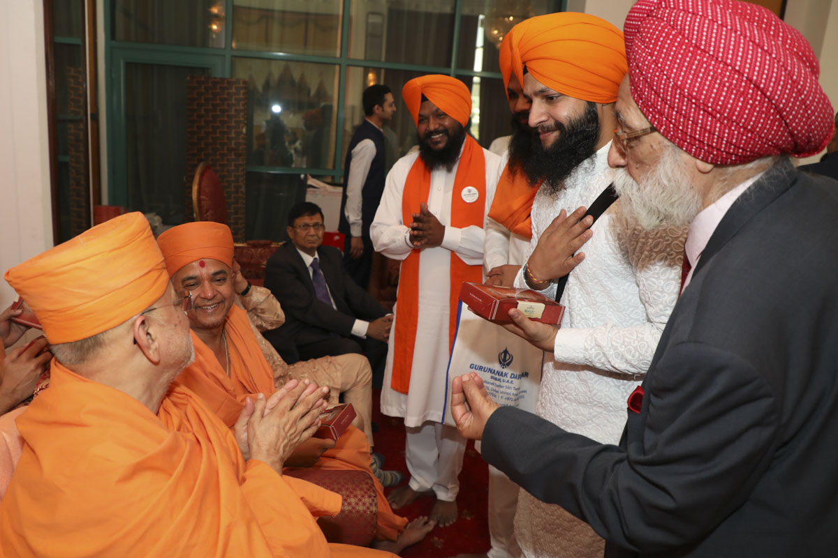 Visitors meet Pujya Ishwarcharan Swami
