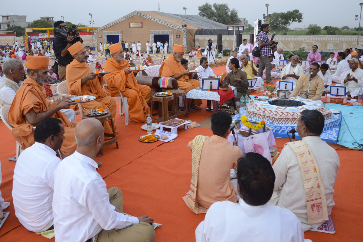 Sadhus and devotees participate in the yagna rituals