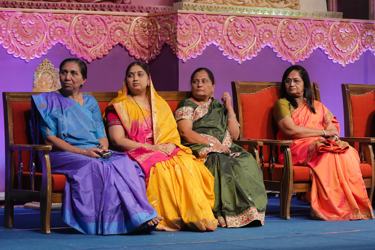 Dignitaries on the stage during the assembly