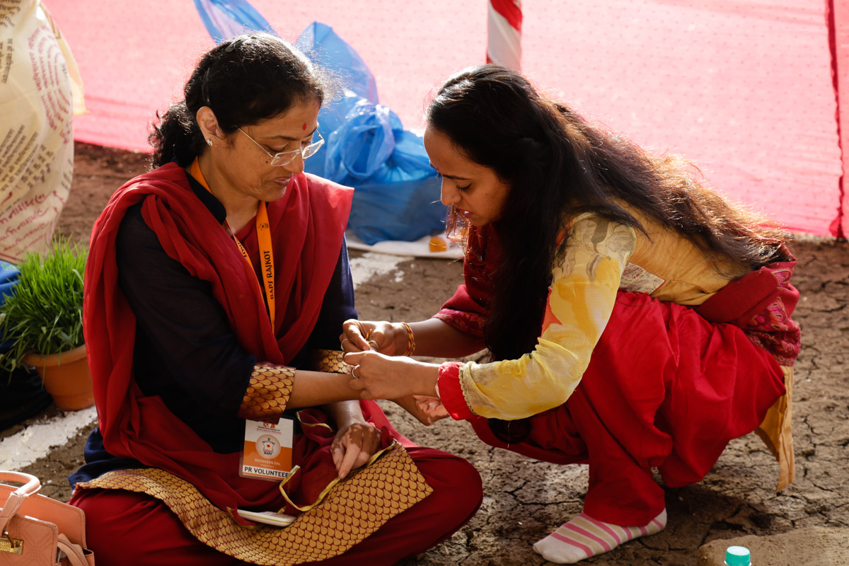 Devotees participate in yagna rituals