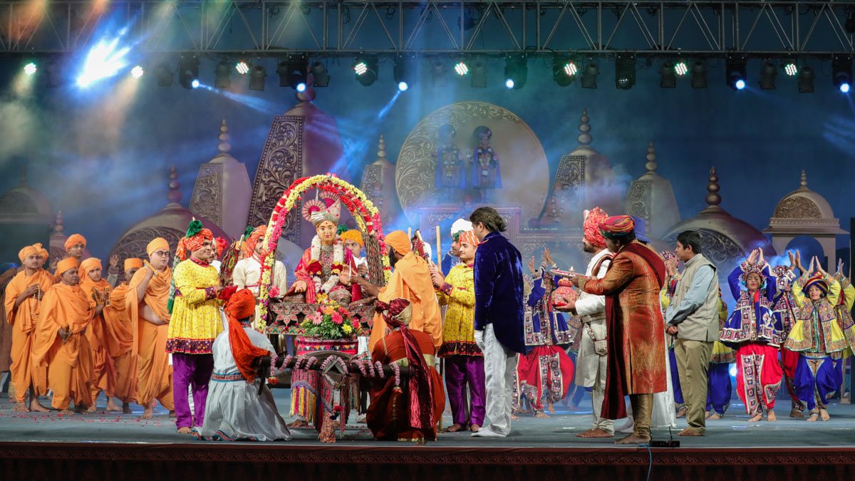 Children and youths present a cultural program: 'Rajkot Satsang Gatha' in the evening satsang assembly