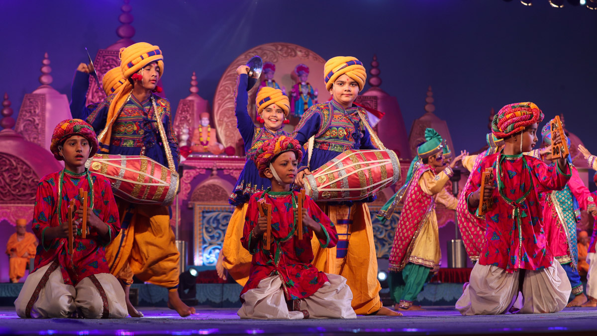Children and youths perform a traditional dance