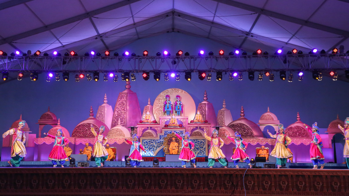 Children and youths perform a traditional dance