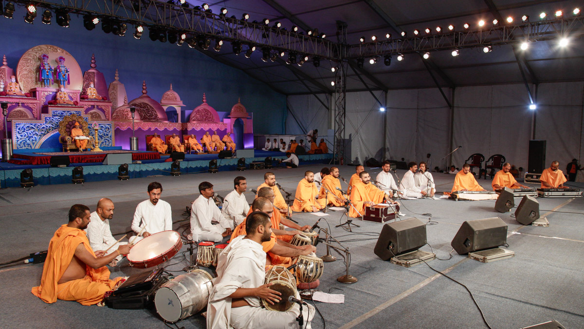 Sadhus and youths present kirtan aradhana in the evening satsang assembly