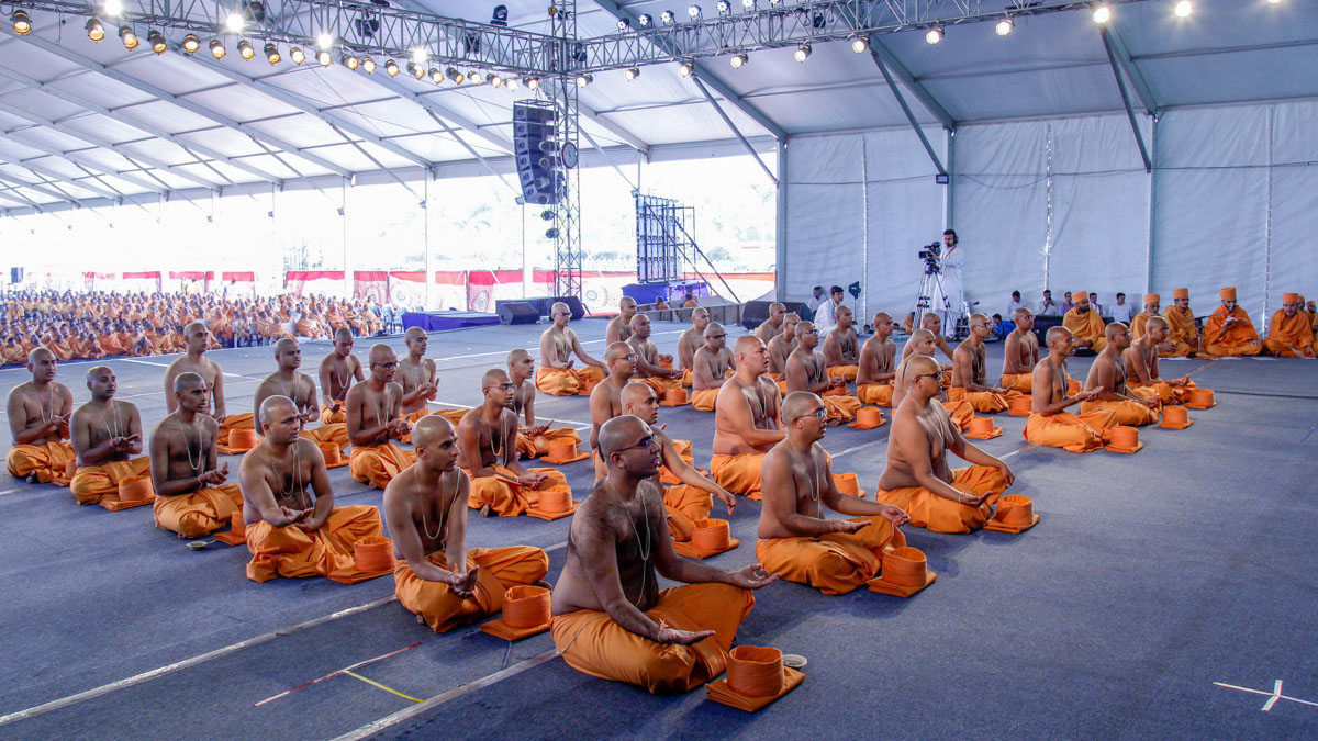 The new initiates perform diksha rituals