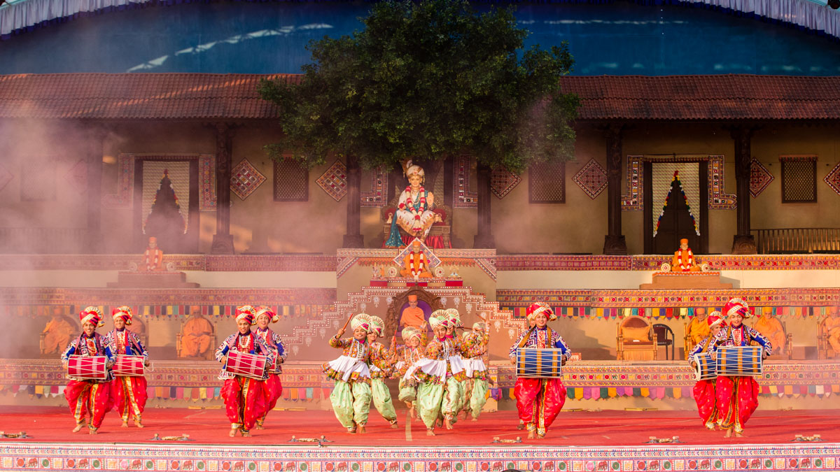 Children and youths perform a traditional dance