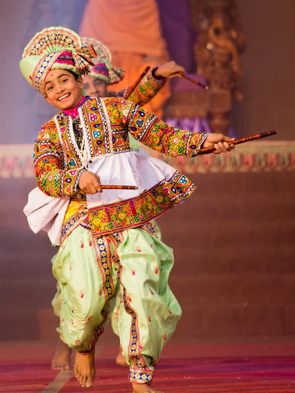 Children and youths perform a traditional dance