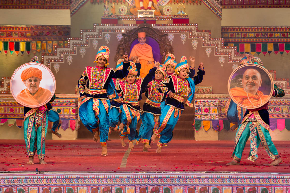 Children and youths perform a traditional dance