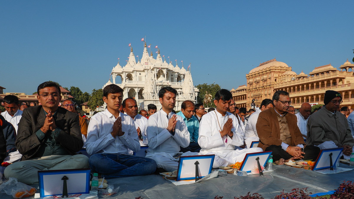 Devotees participate in the mahapuja rituals