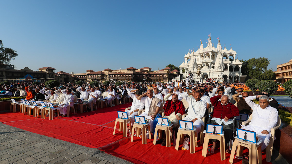 Devotees participate in the mahapuja rituals