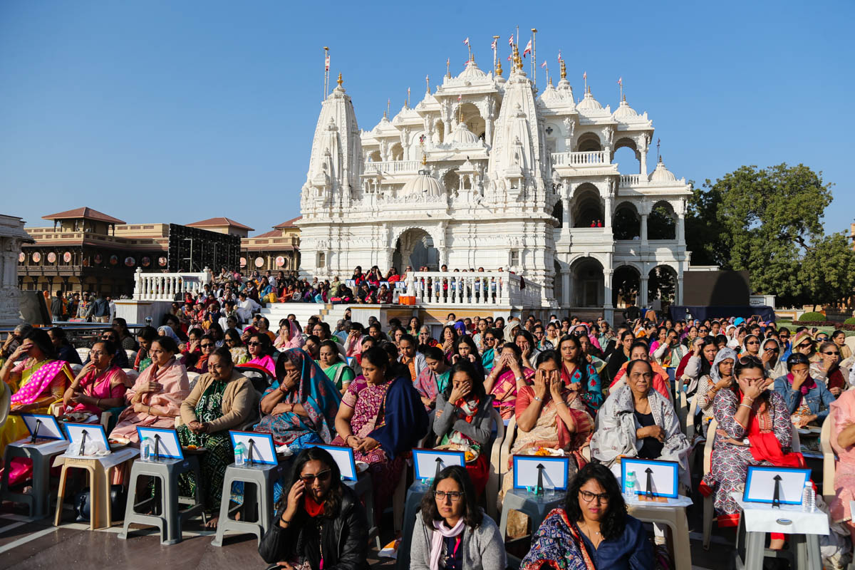 Devotees participate in the mahapuja rituals