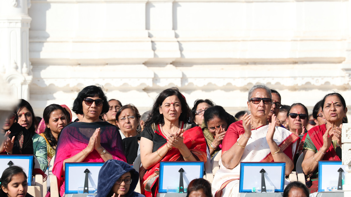 Devotees participate in the mahapuja rituals