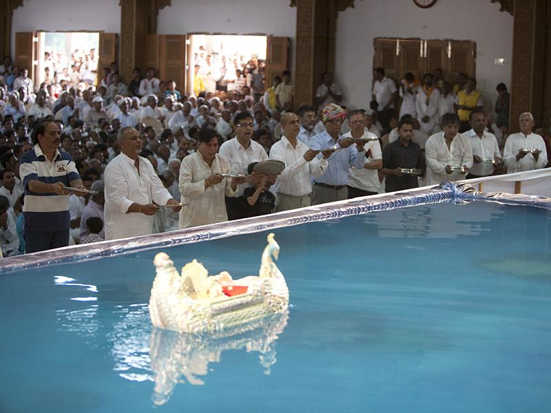 Shri Harikrishna Maharaj in a boat
