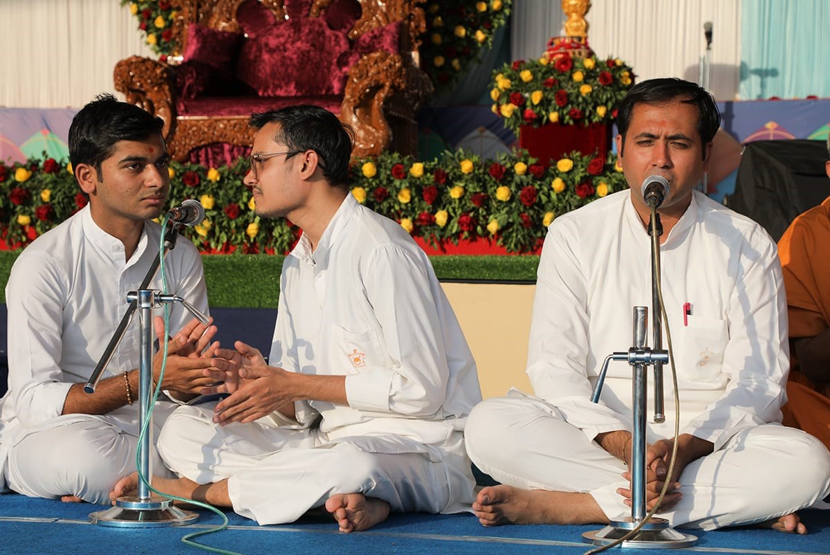 Youths sing kirtans in the assembly