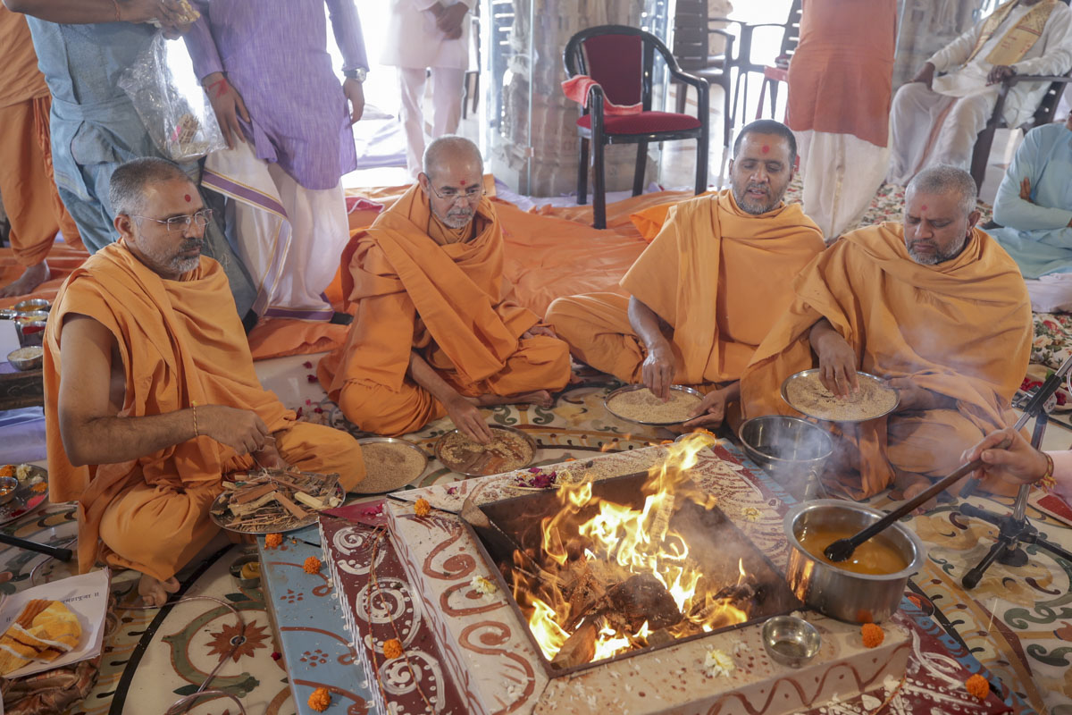 Sadhus perform the Vastu-Mandir Pravesh rituals