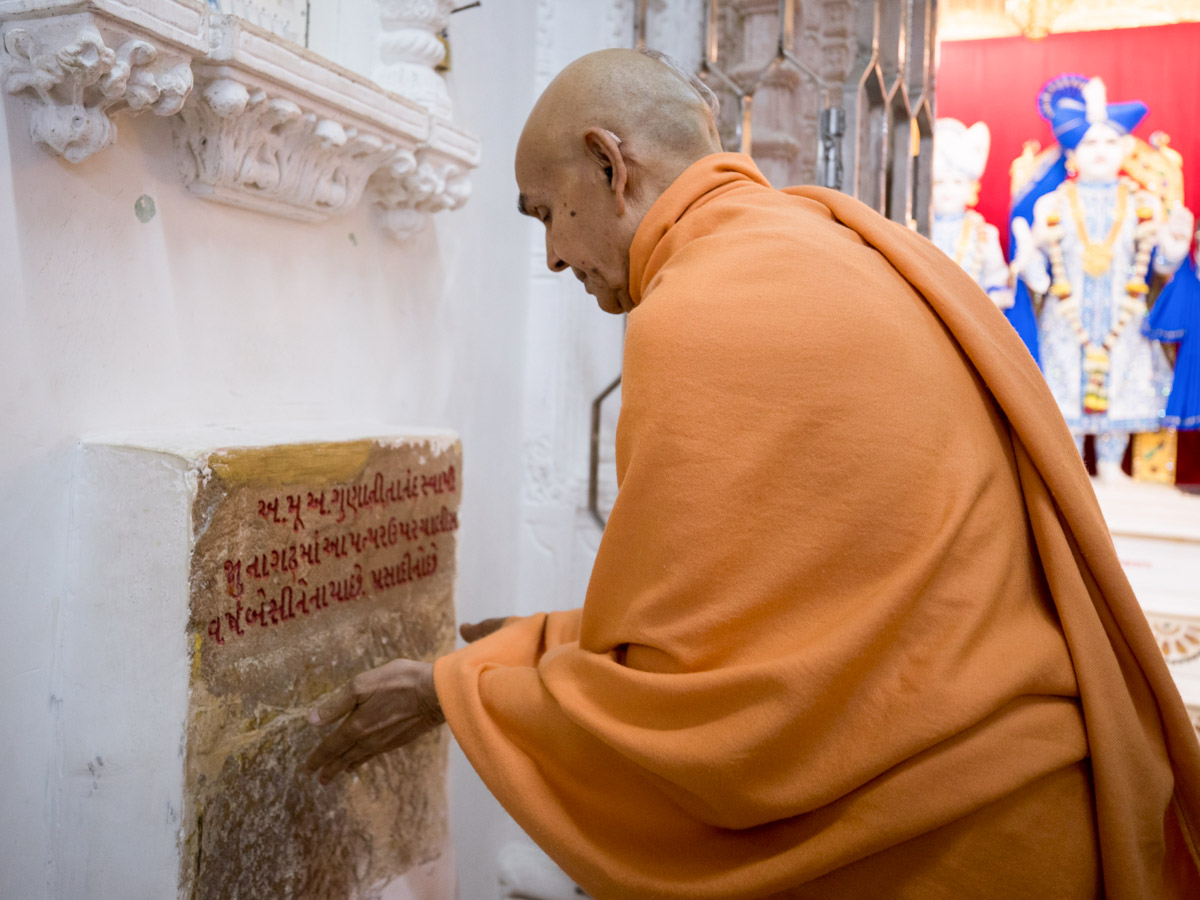 Swamishri reverentially touches sacred stone