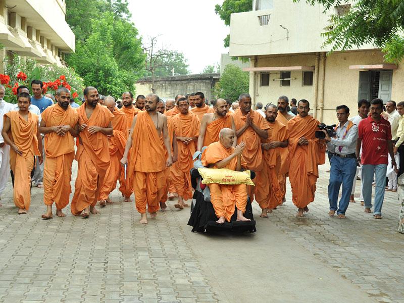 Swamishri on his way for his morning puja 