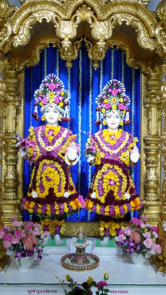  Shri Akshar-Purushottam Maharaj adorned with flowers