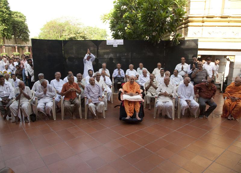 Swamishri with senior devotees