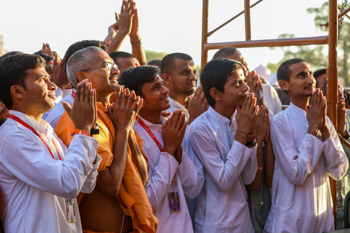 Sadhus and youths doing darshan of Swamishri
