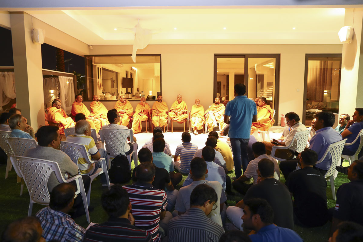 Sadhus and volunteers during a planning meeting