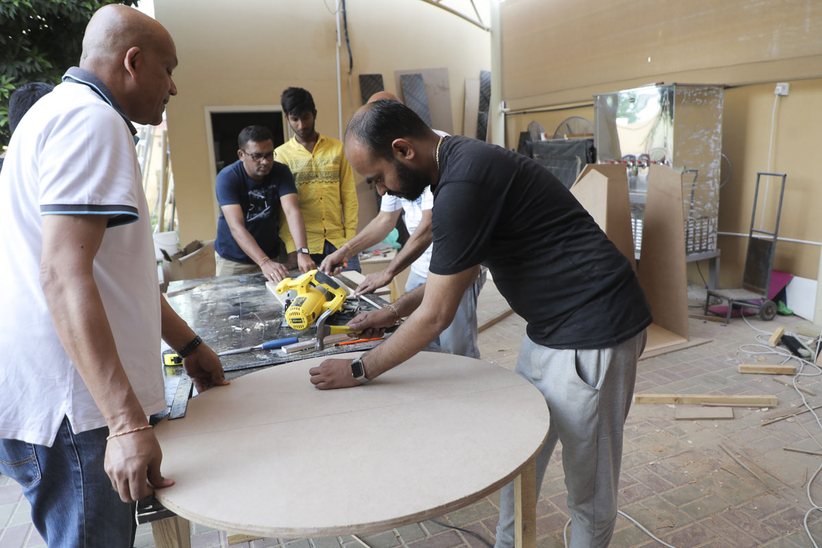 Volunteers prepare the decorations for the ceremony