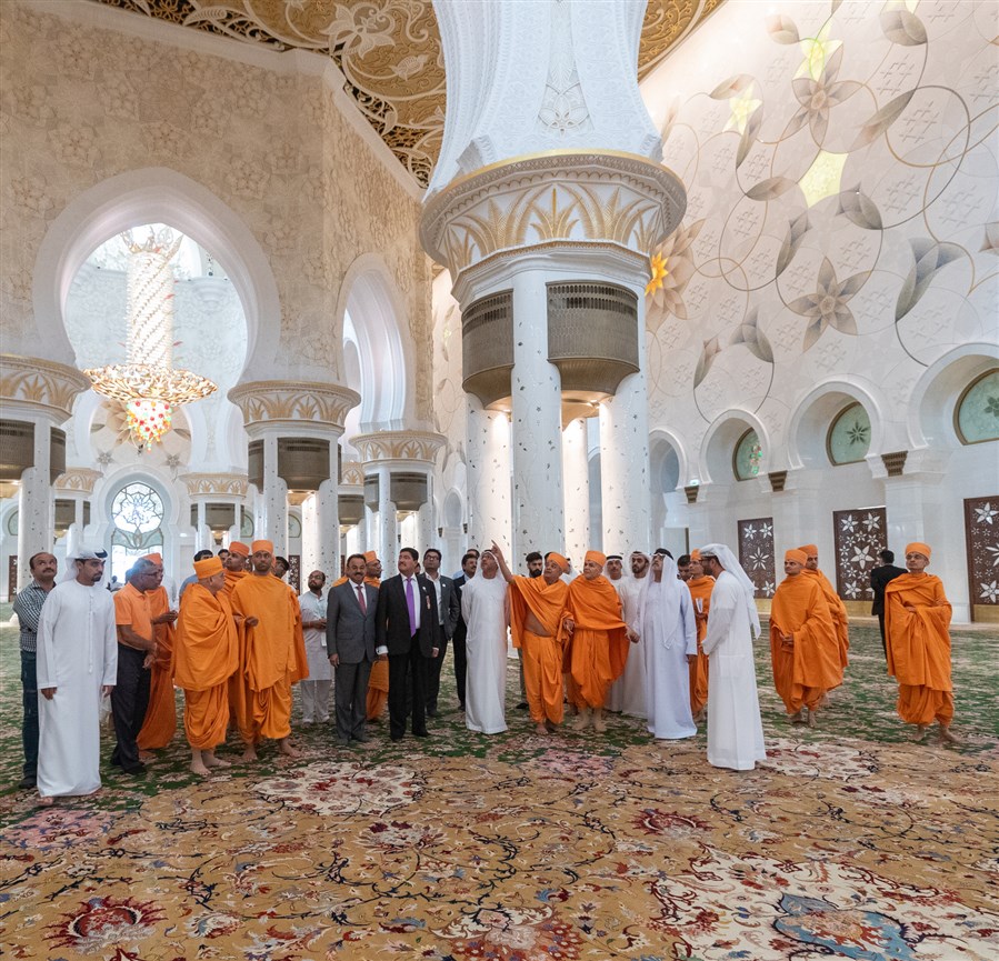 His Holiness Mahant Swami Maharaj observes the inscriptions of the 99 auspicious names of Allah