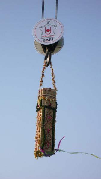  First pillar lifted by crane and being placed on mandir plinth