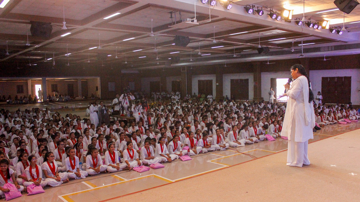 A karyakar addresses the assembly