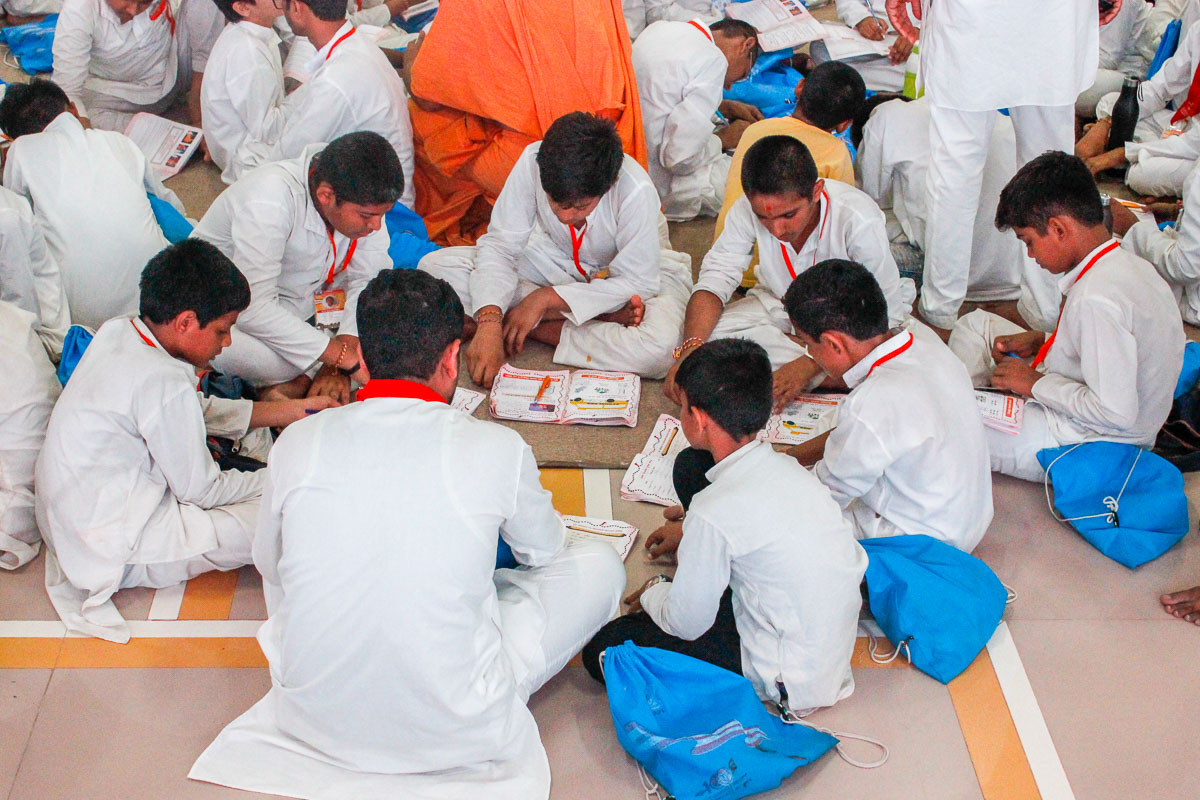 Balaks doing group activities before the evening assembly