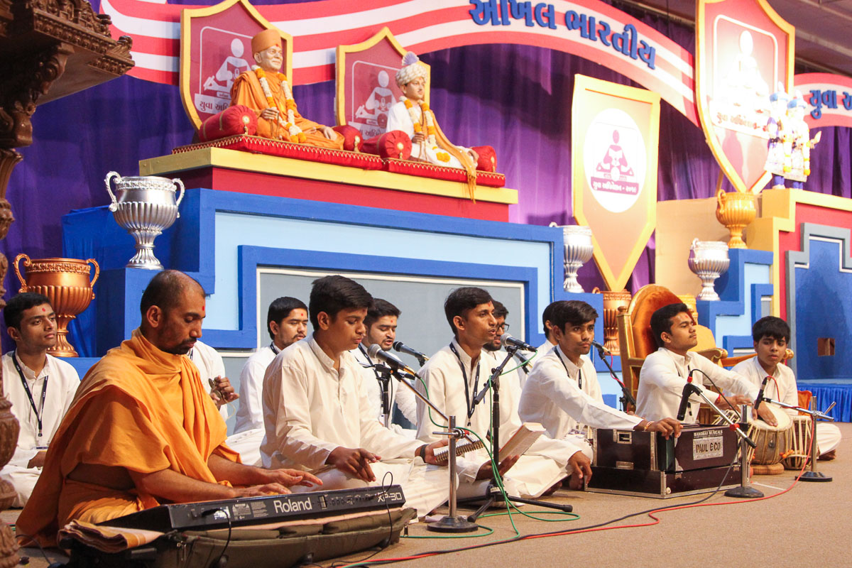 Youths sing kirtans at the start of the shibir
