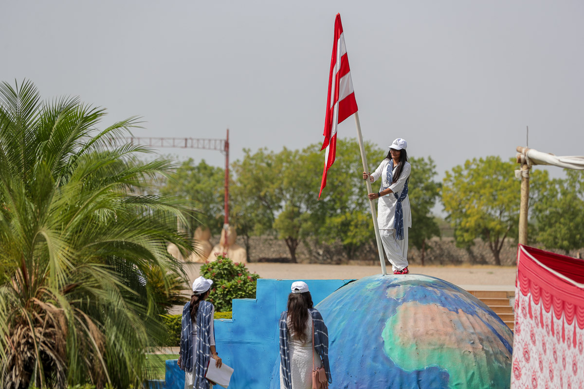 A yuvati stands for a photo at a photo spot