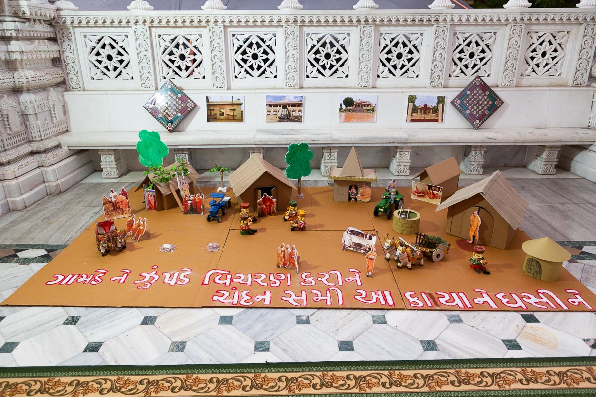 A display depicting Pramukh Swami Maharaj's vicharan to the villages