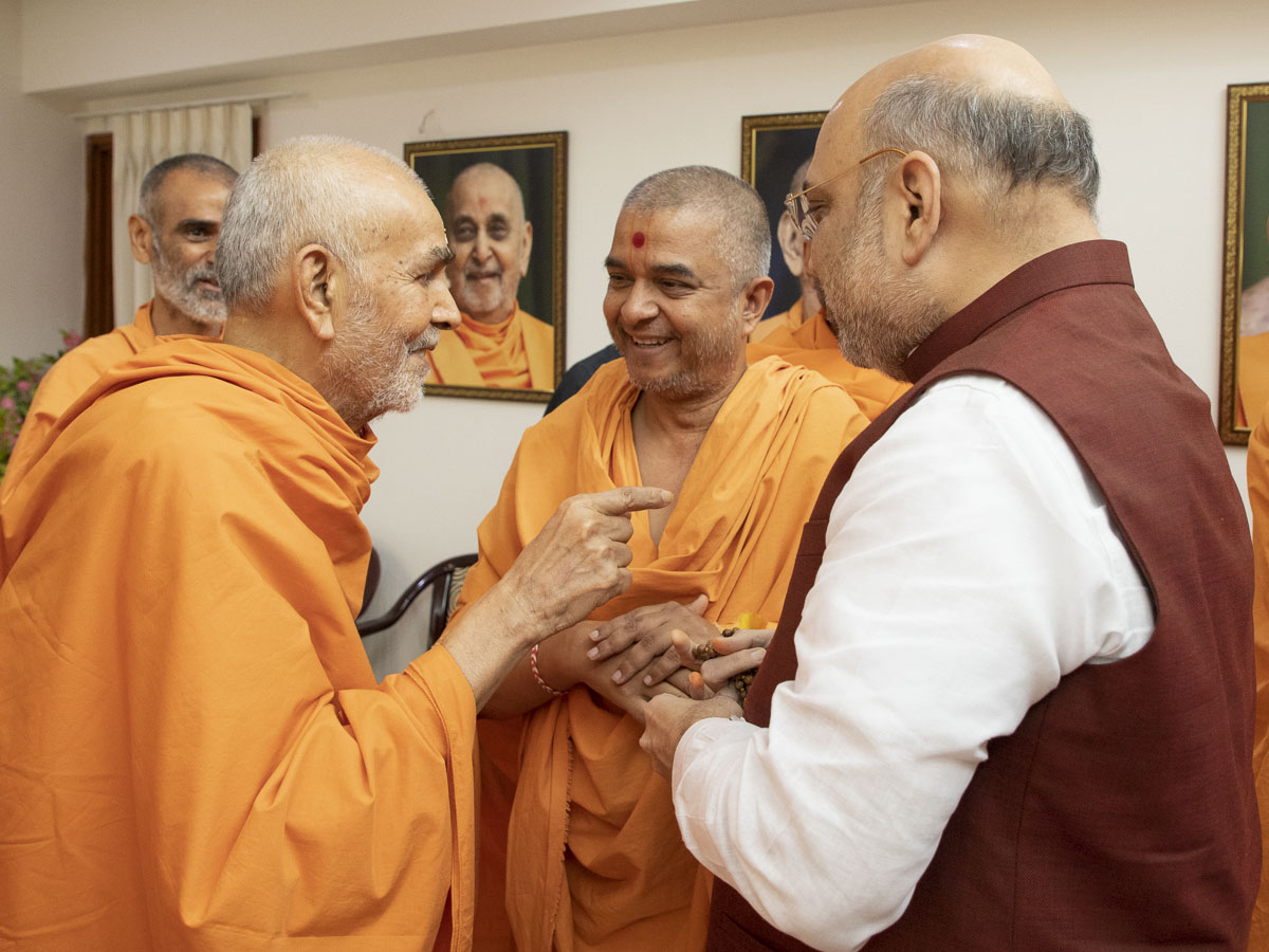 Swamishri in conversation with Shri Amit Shah