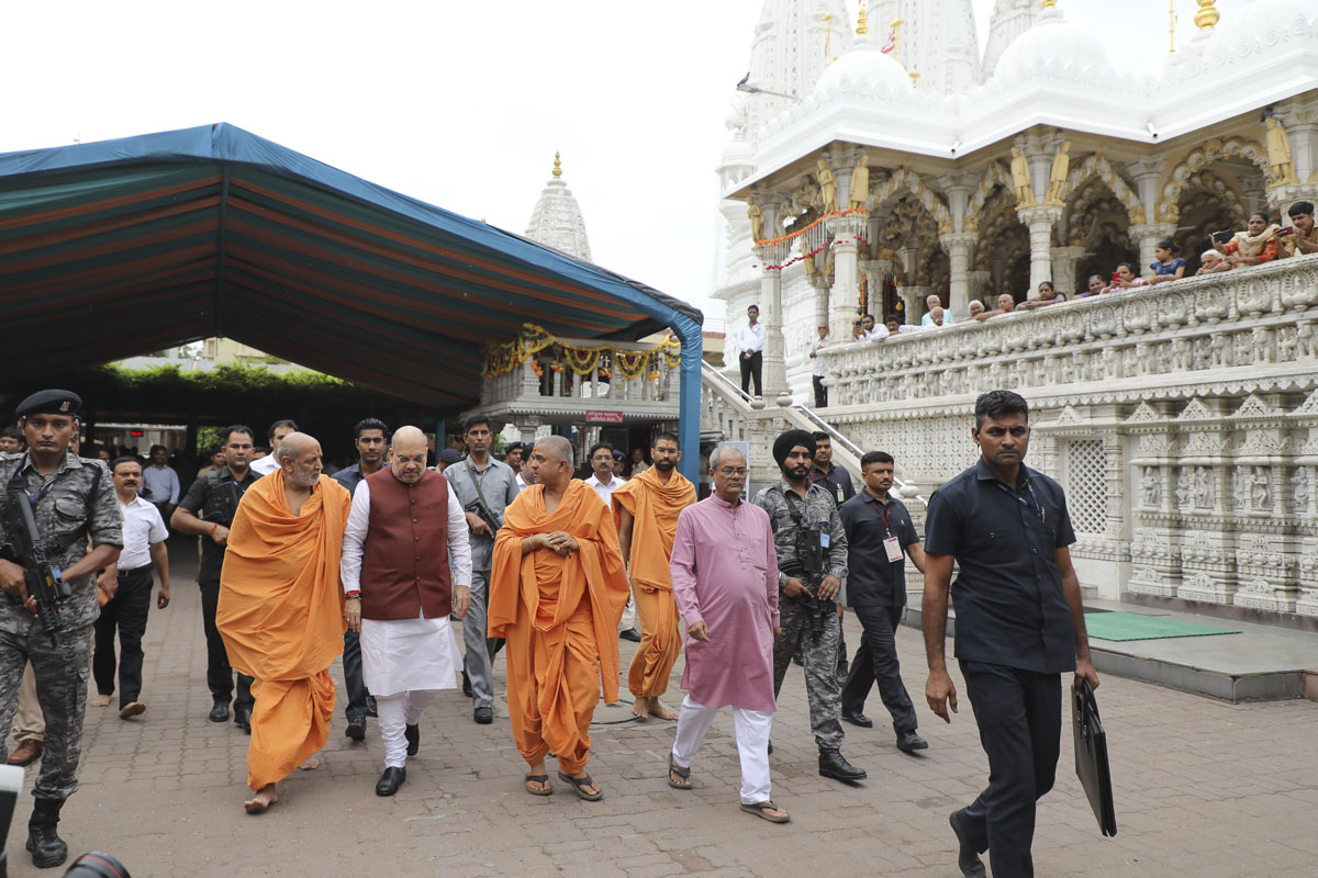 Shri Amit Shah departs from the BAPS Shri Swaminarayan Mandir, Shahibaug