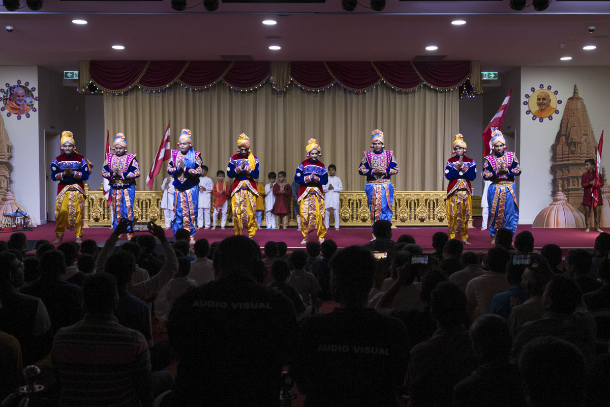 Youths perform a welcome dance