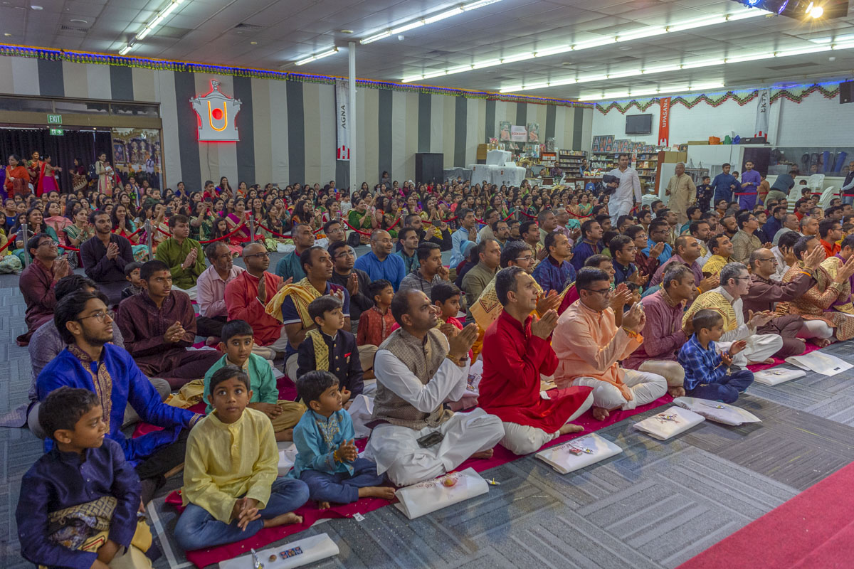 Devotees participate in mahapuja rituals