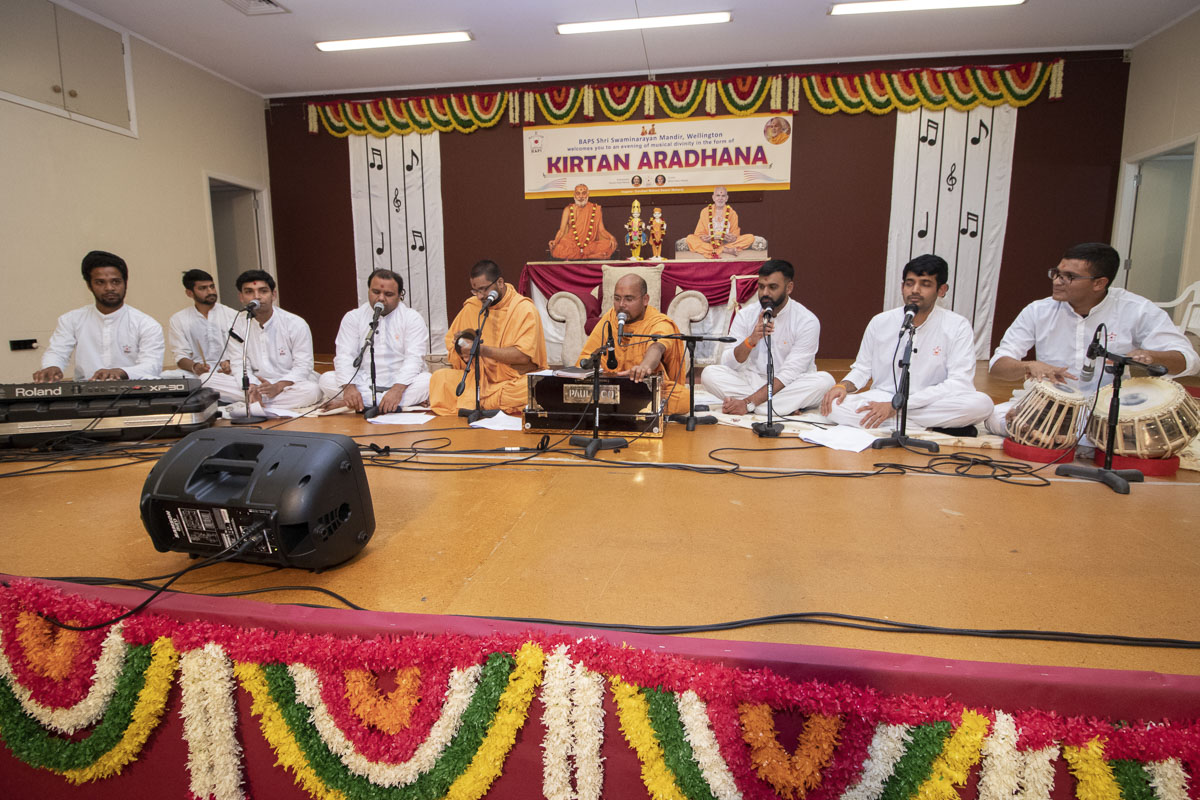 Sadhus and youths sing kirtans in the assembly