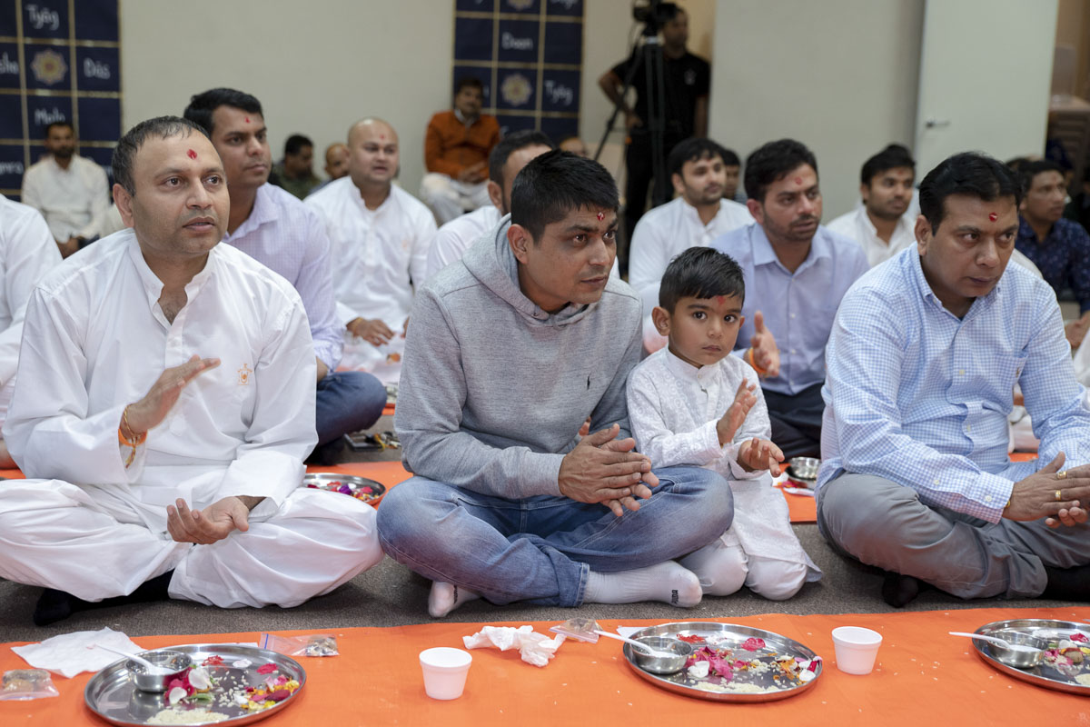Devotees participate in patotsav mahapuja rituals