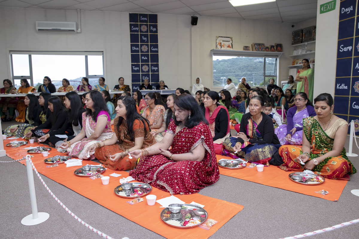 Devotees participate in patotsav mahapuja rituals