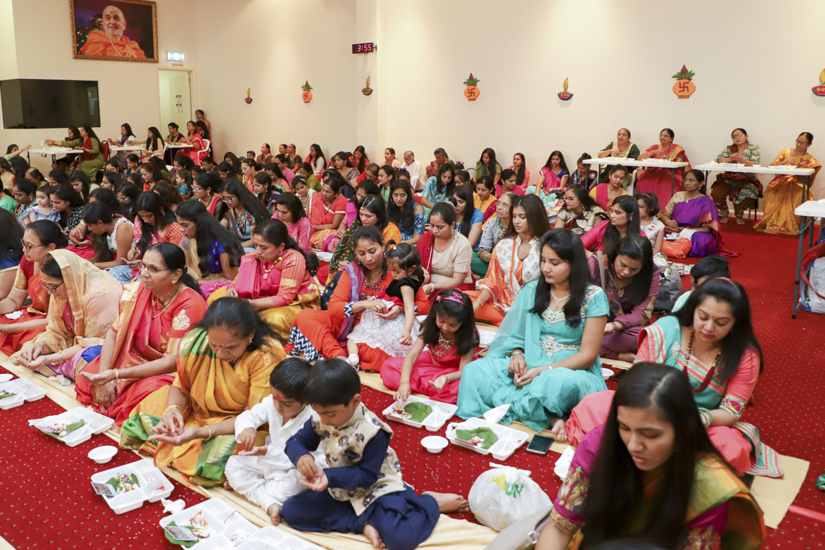 Devotees participate in patotsav mahapuja rituals